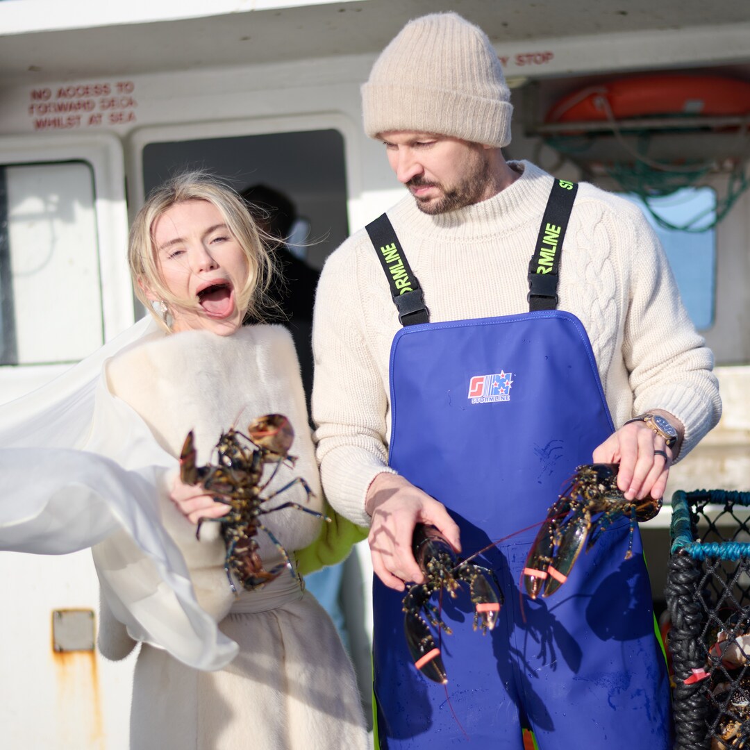 James Watt and Georgia Toffolo holding lobsters at their wedding.