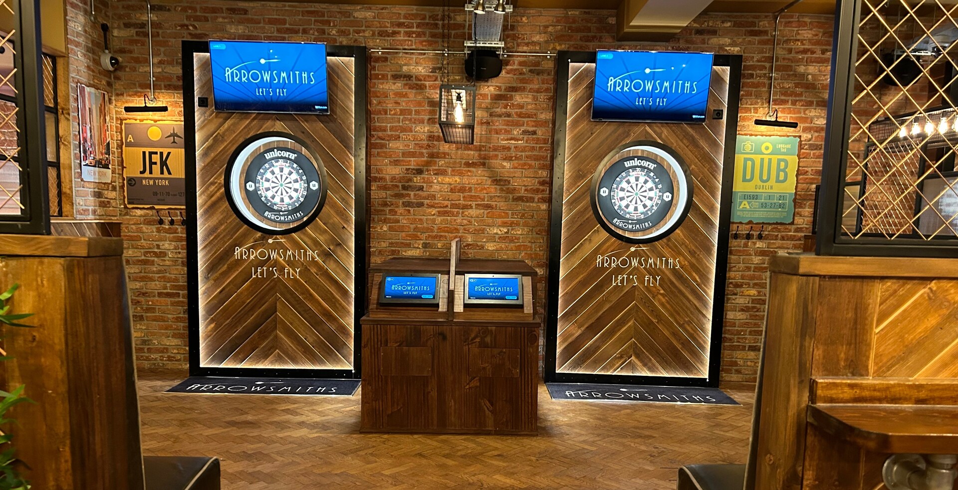 Arrowsmiths dart boards and electronic scoring system in a pub.