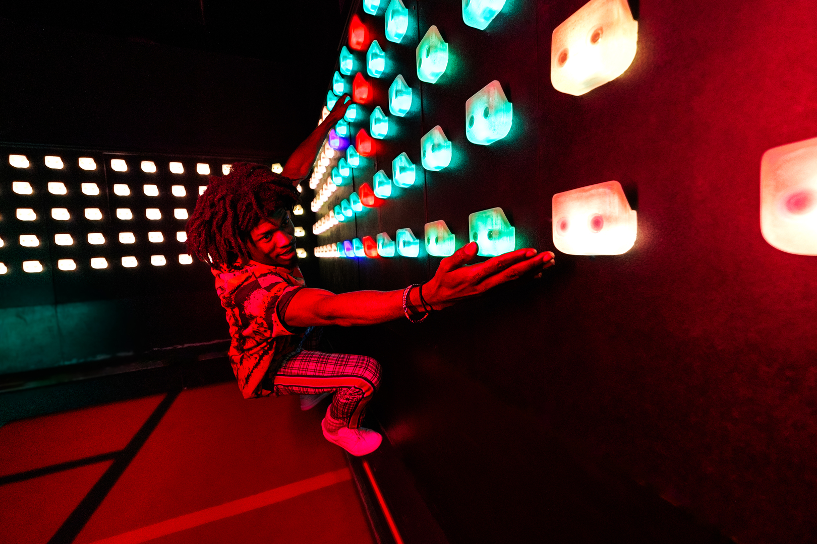Person playing a light-up game.