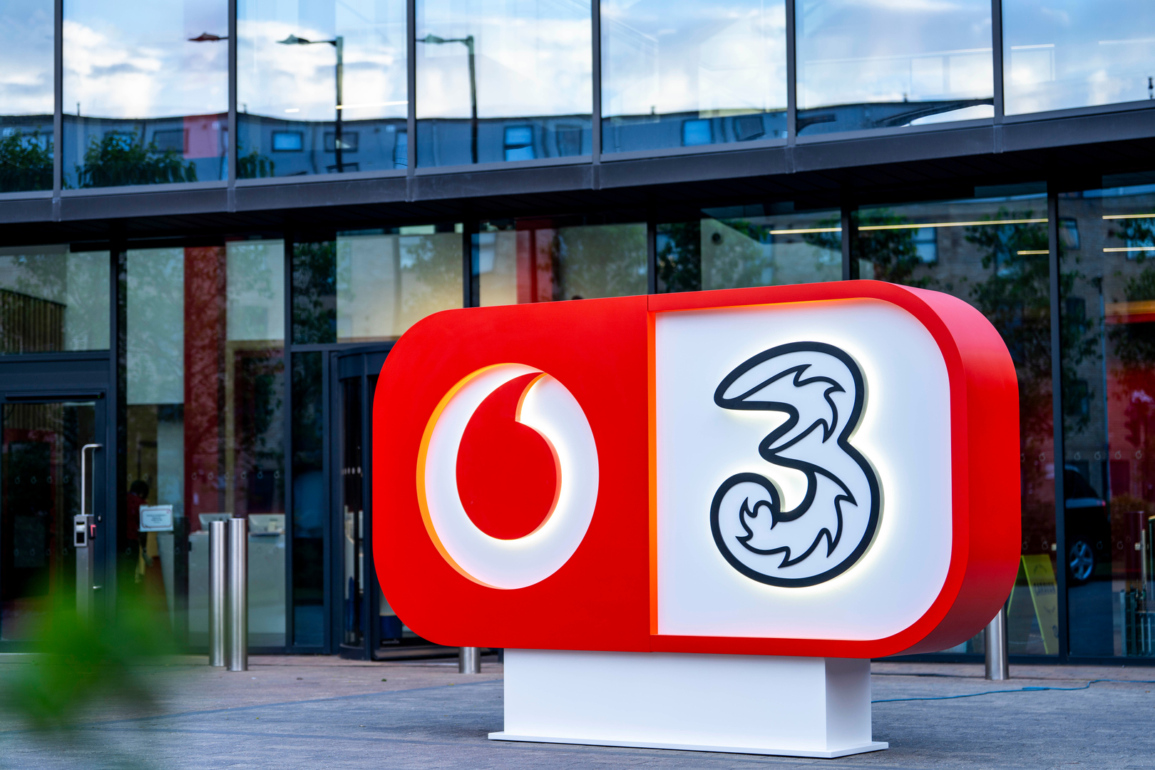 VodafoneThree logo.