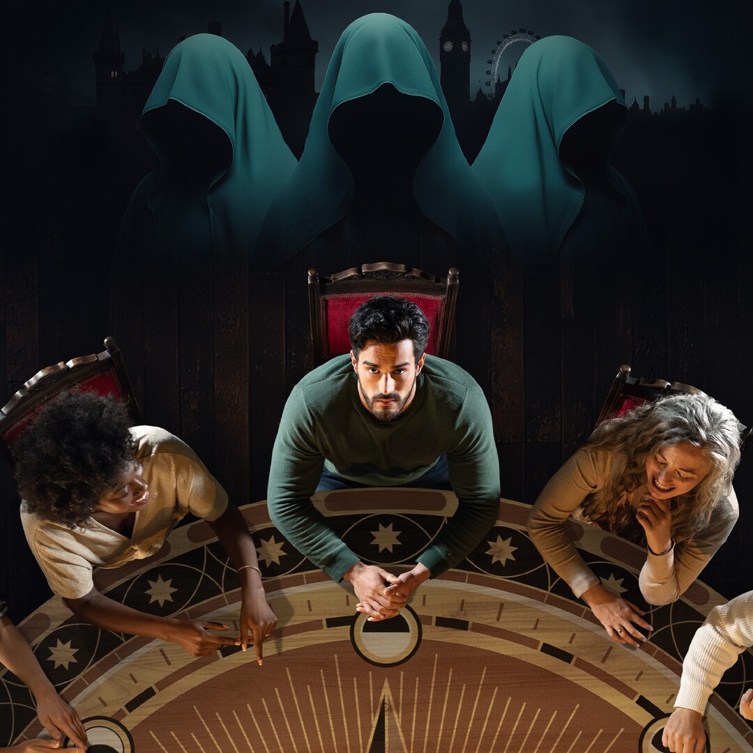 Illustration of people playing a game around a circular table, with hooded figures looming in the background.