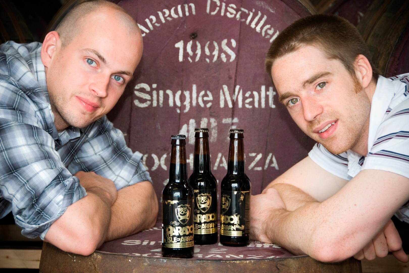 BrewDog founders James Watt and Martin Dickie with bottles of Paradox Isle of Arran beer.